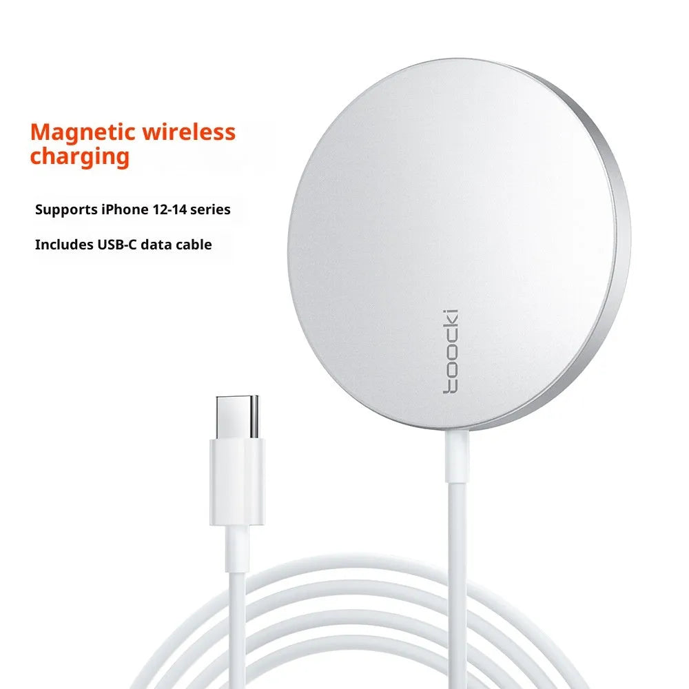 White simulation Apple-style 15W magnetic wireless charger on a table with a smartphone