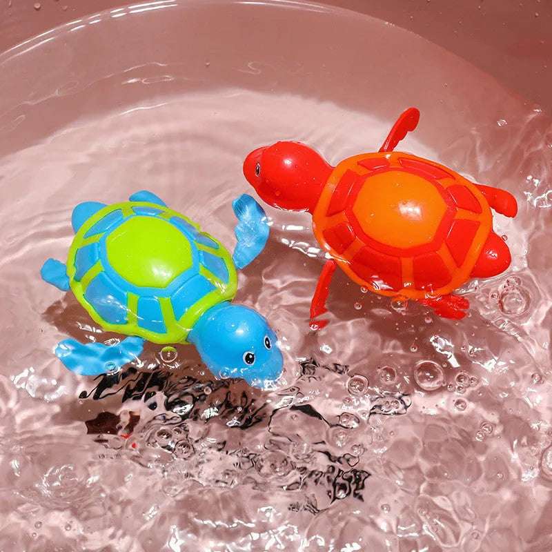 Plastic baby tortoise bathroom toy floating in water, random colour, approximately 12 cm long