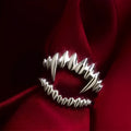 Silver vampire split open ring on finger showing adjustable opening and zinc alloy construction