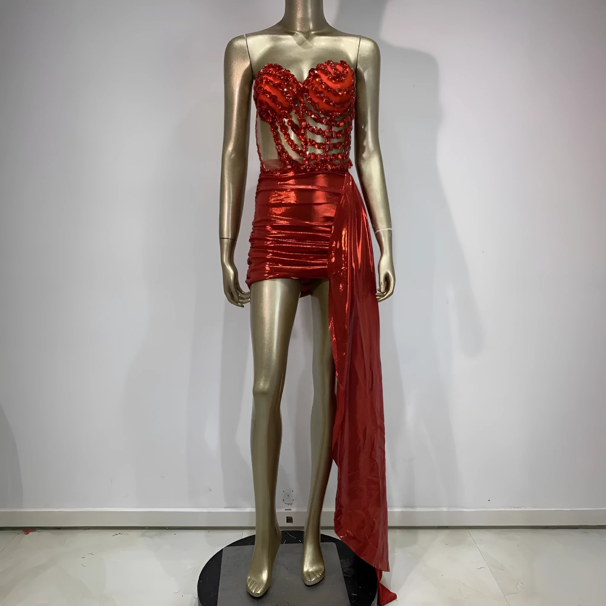 Red two-piece stage costume skirt suit with see-through mesh panels and a form-fitting spandex design.