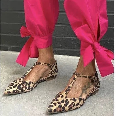 Leopard print women's pumps with pointed toe, chunky low heel and cross shoulder strap