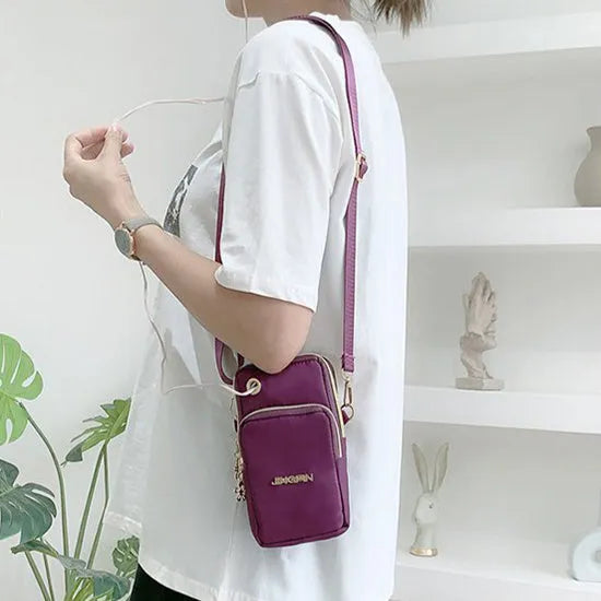 Nylon crossbody mobile phone bag with three zippered layers, card slots, and an adjustable strap in black