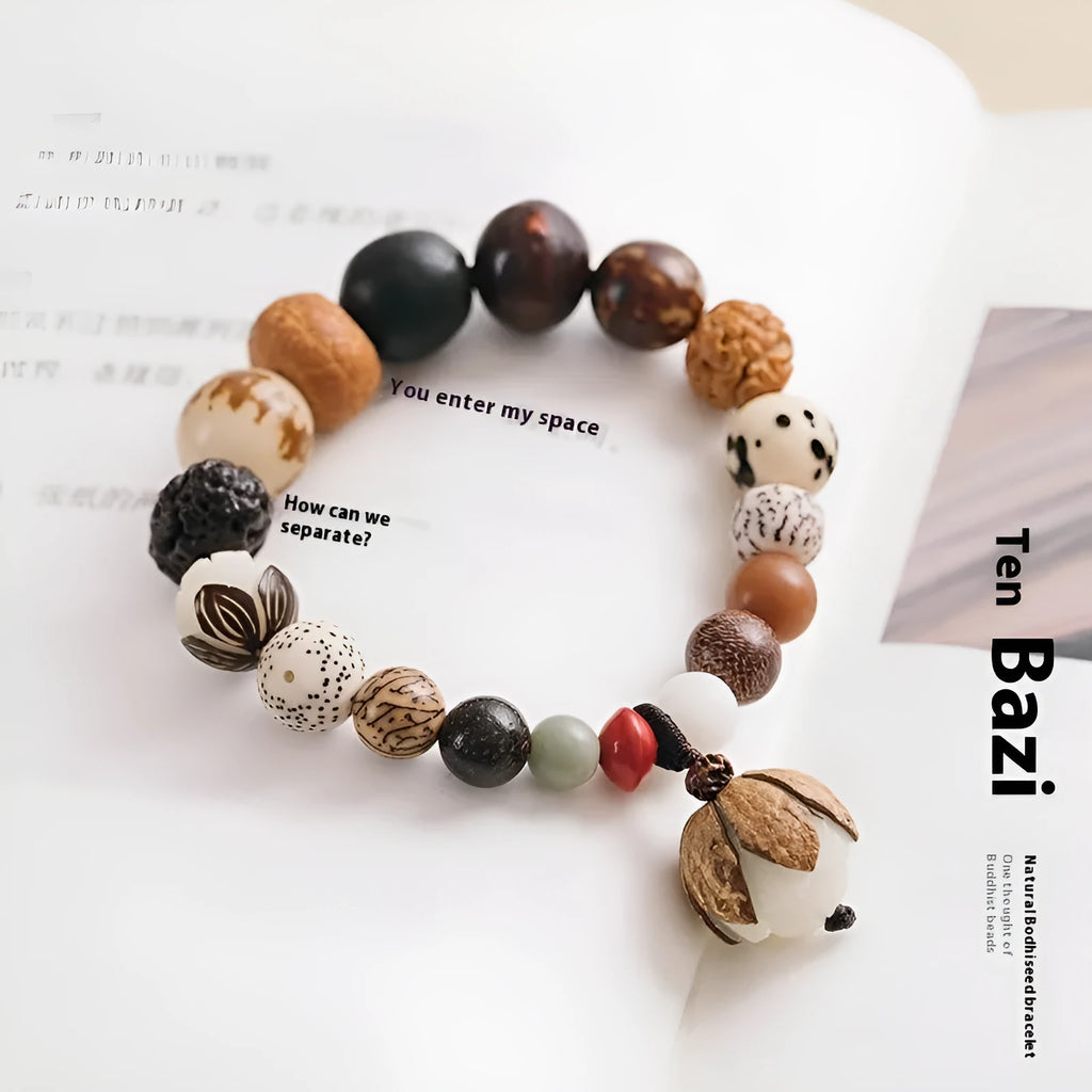 Handmade brown Bodhi seed bead bracelet with geometric design on a 16cm wrist.