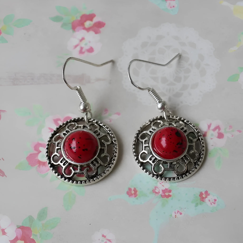 Handmade geometric Miao silver earrings with turquoise and auspicious cloud patterns in black, blue, or red.