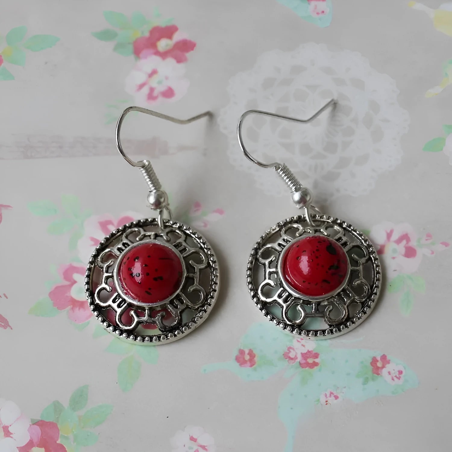 Handmade geometric Miao silver earrings with turquoise and auspicious cloud patterns in black, blue, or red.