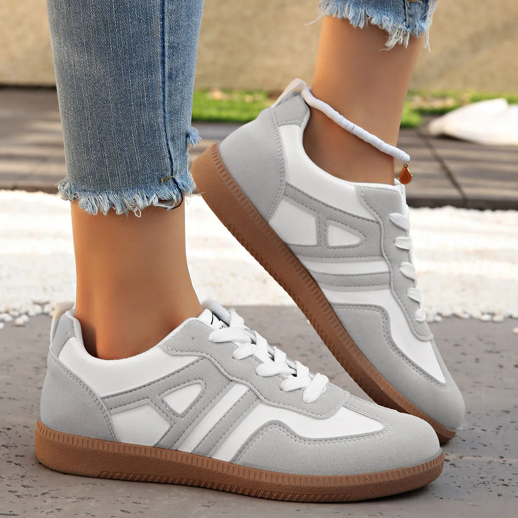 Women's retro colour matching lace-up jogging shoes with platform heel and cross-strap detailing in black, grey, and khaki options