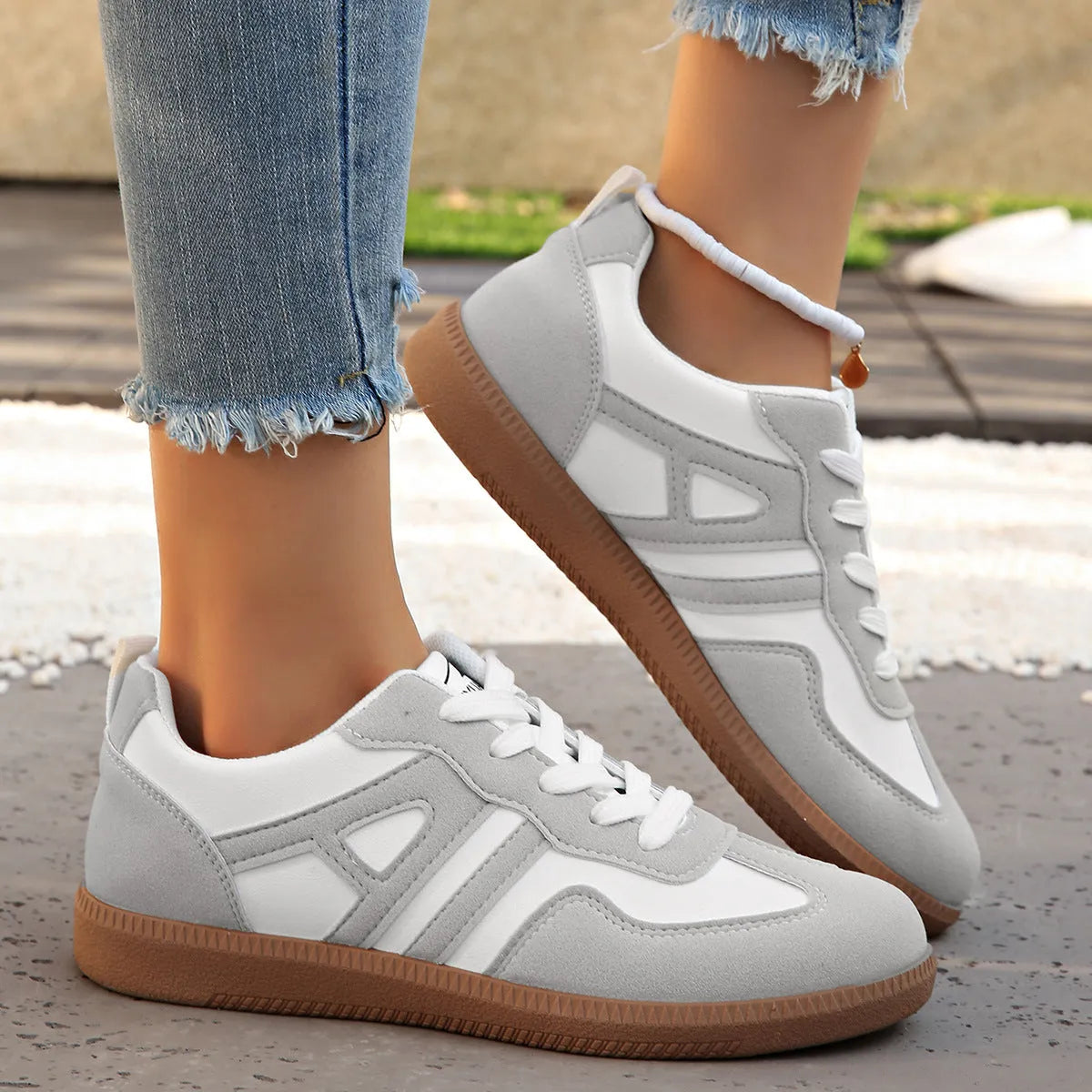 Women's retro colour matching lace-up jogging shoes with platform heel and cross-strap detailing in black, grey, and khaki options