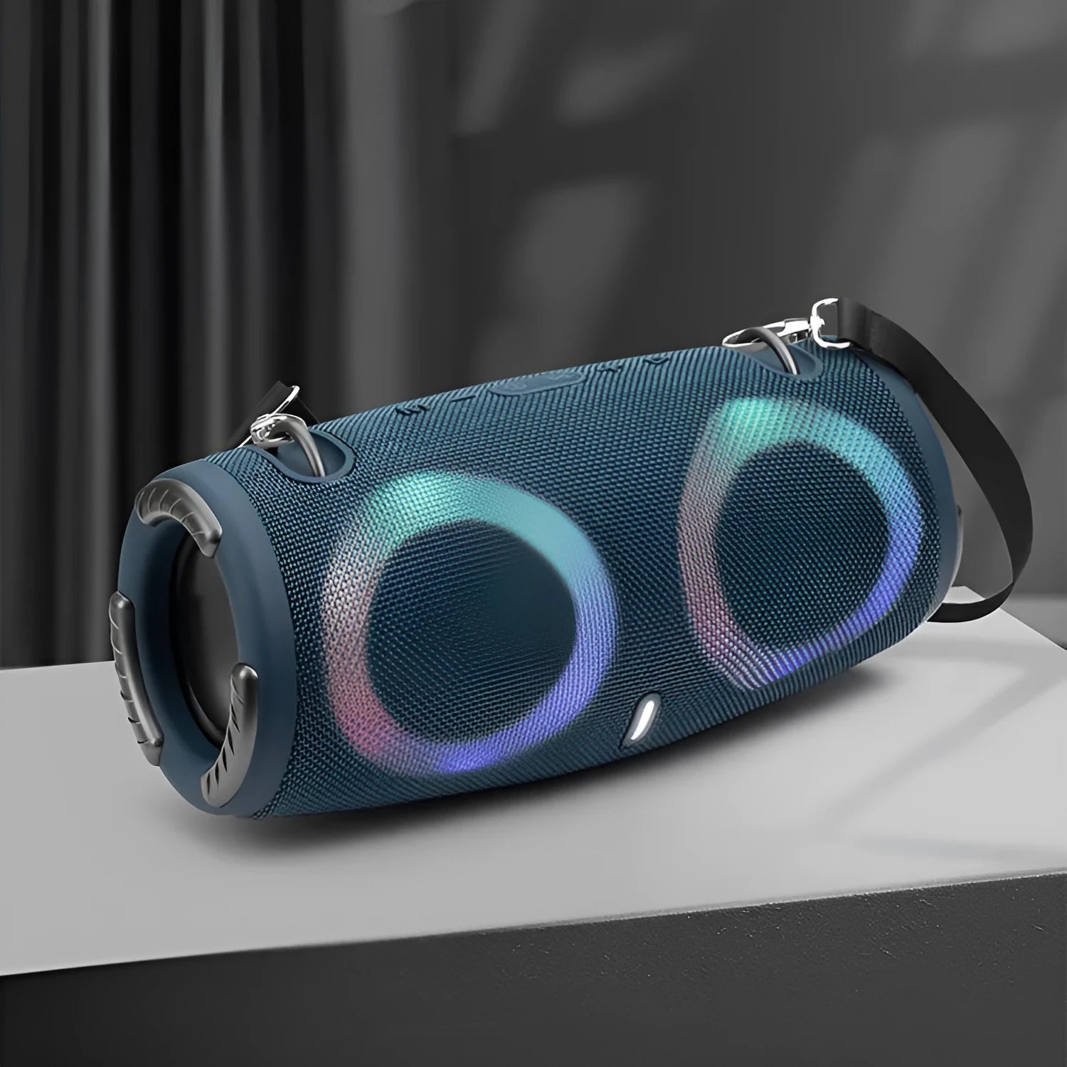 War Drum portable Bluetooth speaker in camouflage colour with dynamic RGB lights, showing carrying strap and control buttons.