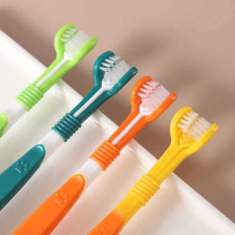 Pet toothbrush with soft nylon bristles on a plastic handle in various colour options for dogs and cats