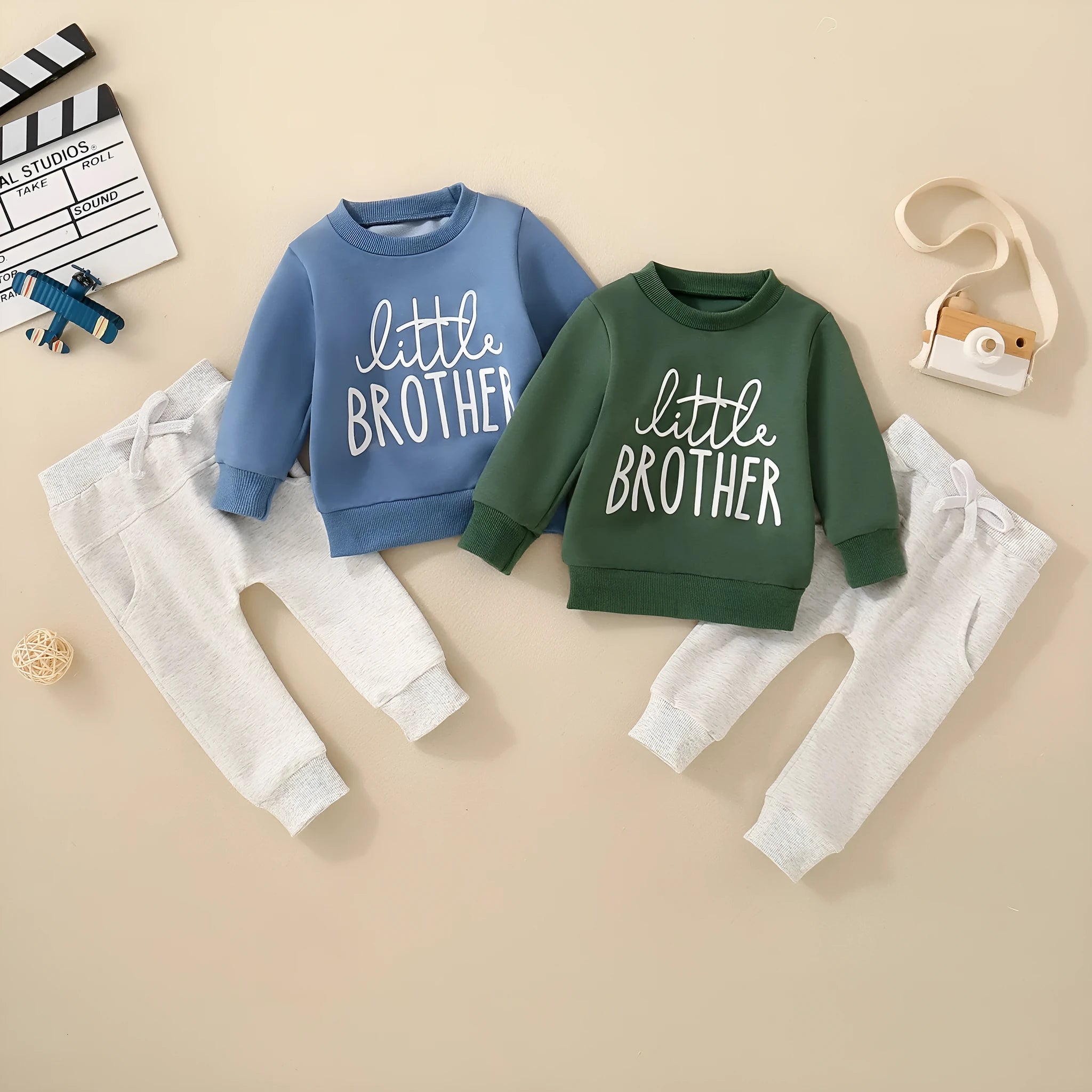 Boys and girls cotton letter long sleeve sweater suit in navy blue with matching pants set on white background.