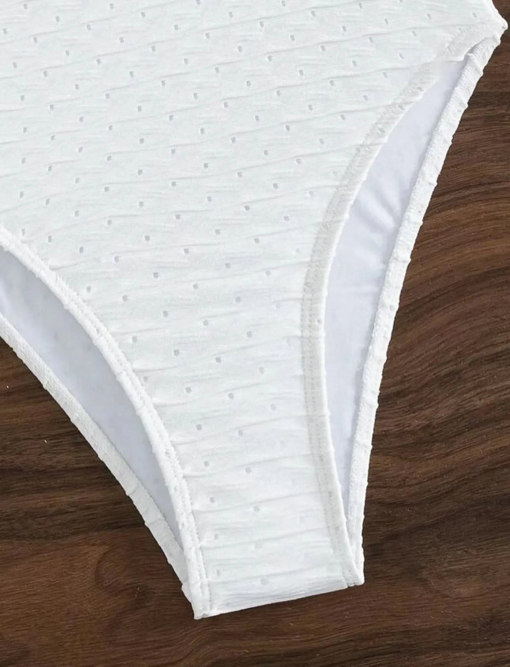 White women's one-piece swimsuit with briefs style on a mannequin