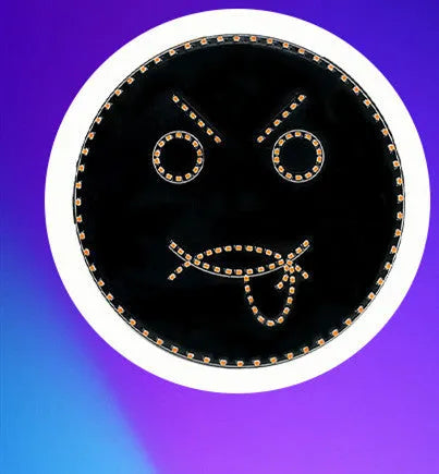 Black car rear window LED expression light showing orange smiley face pattern with remote control