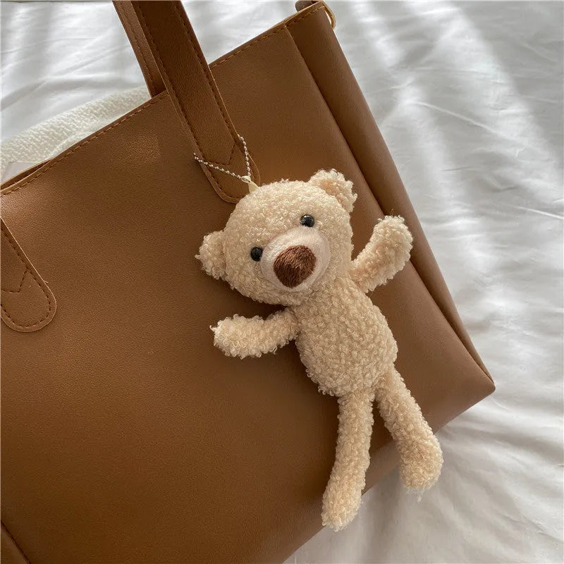 Single shoulder crossbody bag in brown with pendant, horizontal square PU leather student messenger bag