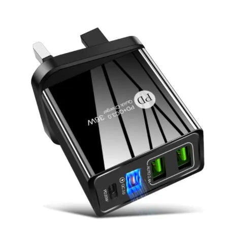 Black and white dual USB travel charger with international plug options showing indicator light