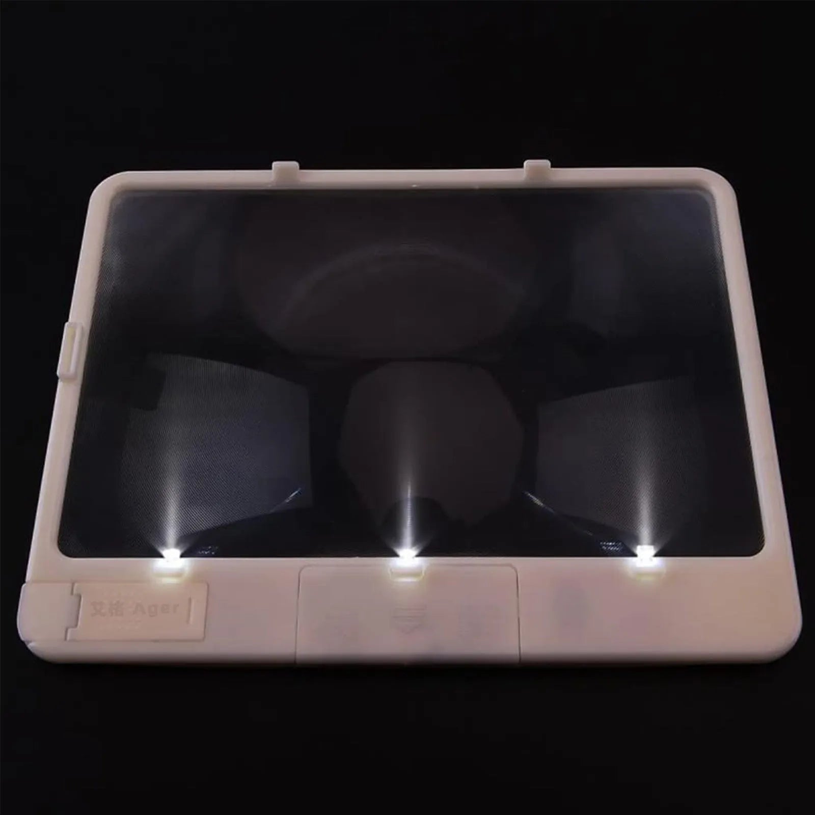 Black and white LED magnifying glass with 3x lens on a desk
