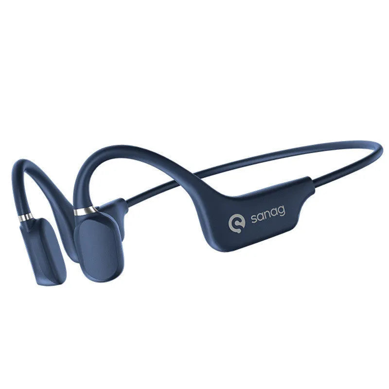 A person wearing black bone conduction Bluetooth headphones around their neck during a run.