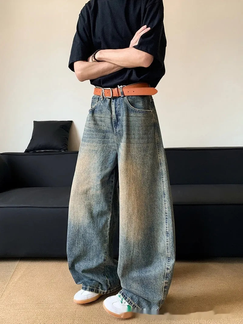 Men's distressed denim jeans in retro blue colour with wide-leg design and mid-waist fit