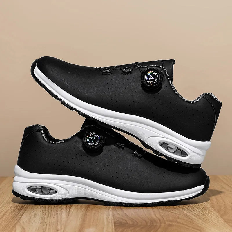Black and white low top casual tennis shoes with cross shoulder straps and mesh upper.
