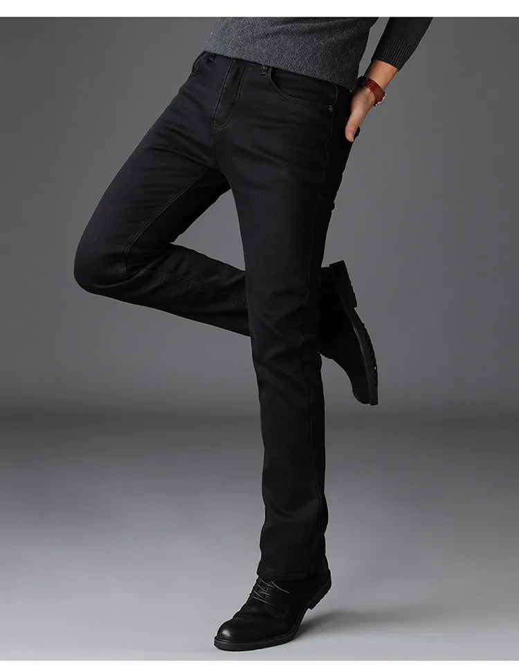 Men's slim straight leg jeans in black cotton denim with mid waist and zip fly, sizes 28-40.