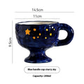 Handmade irregular solid colour ceramic mug on a table