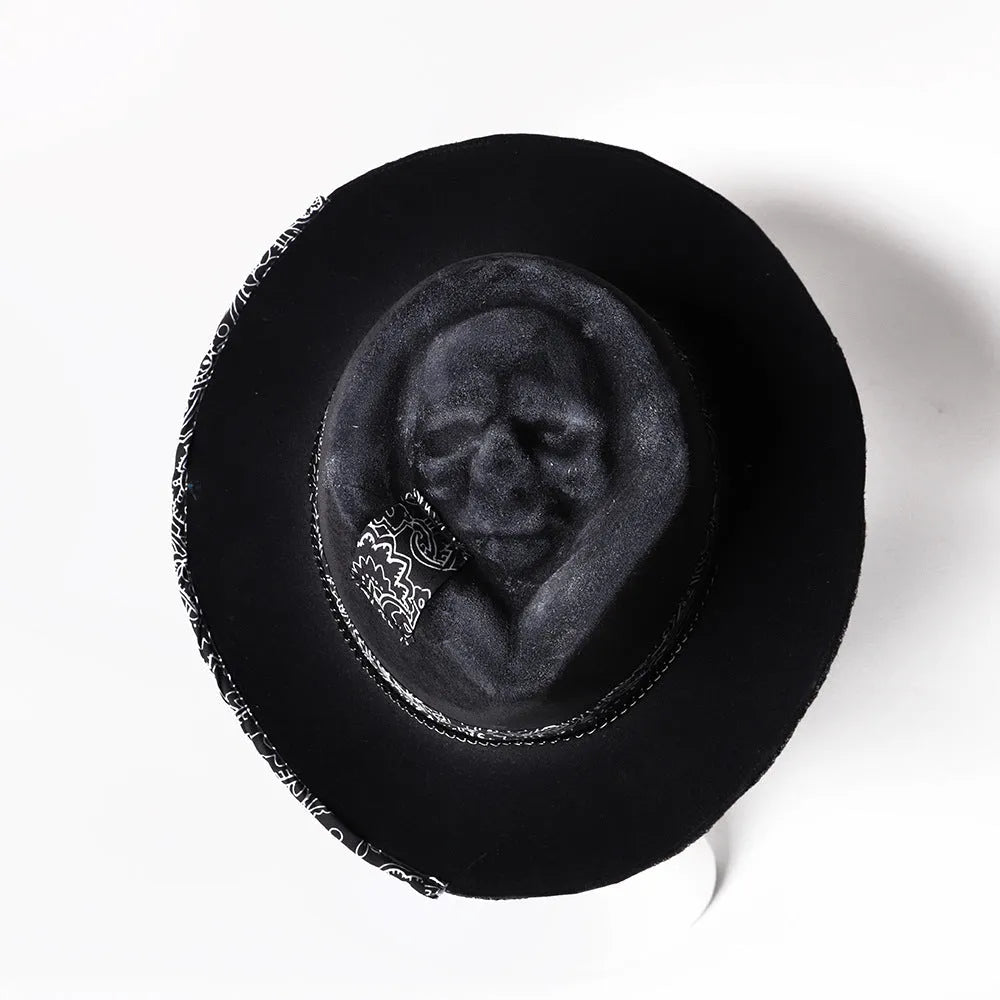 Handmade grey wool felt conical hat with a black embroidered skull design on the front.