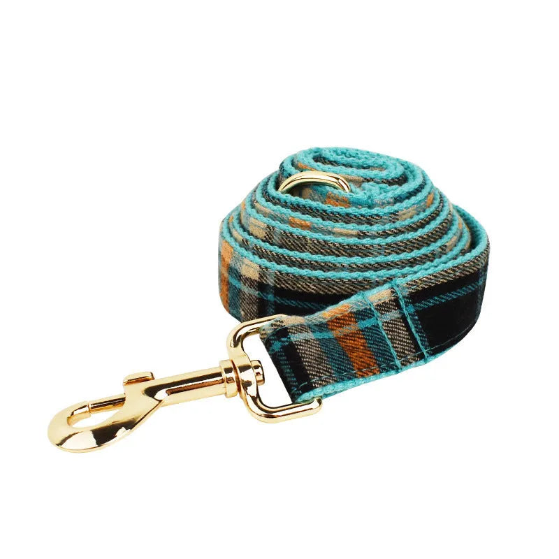 Green retro dog collar set with matching leash, bow, and vest on white background