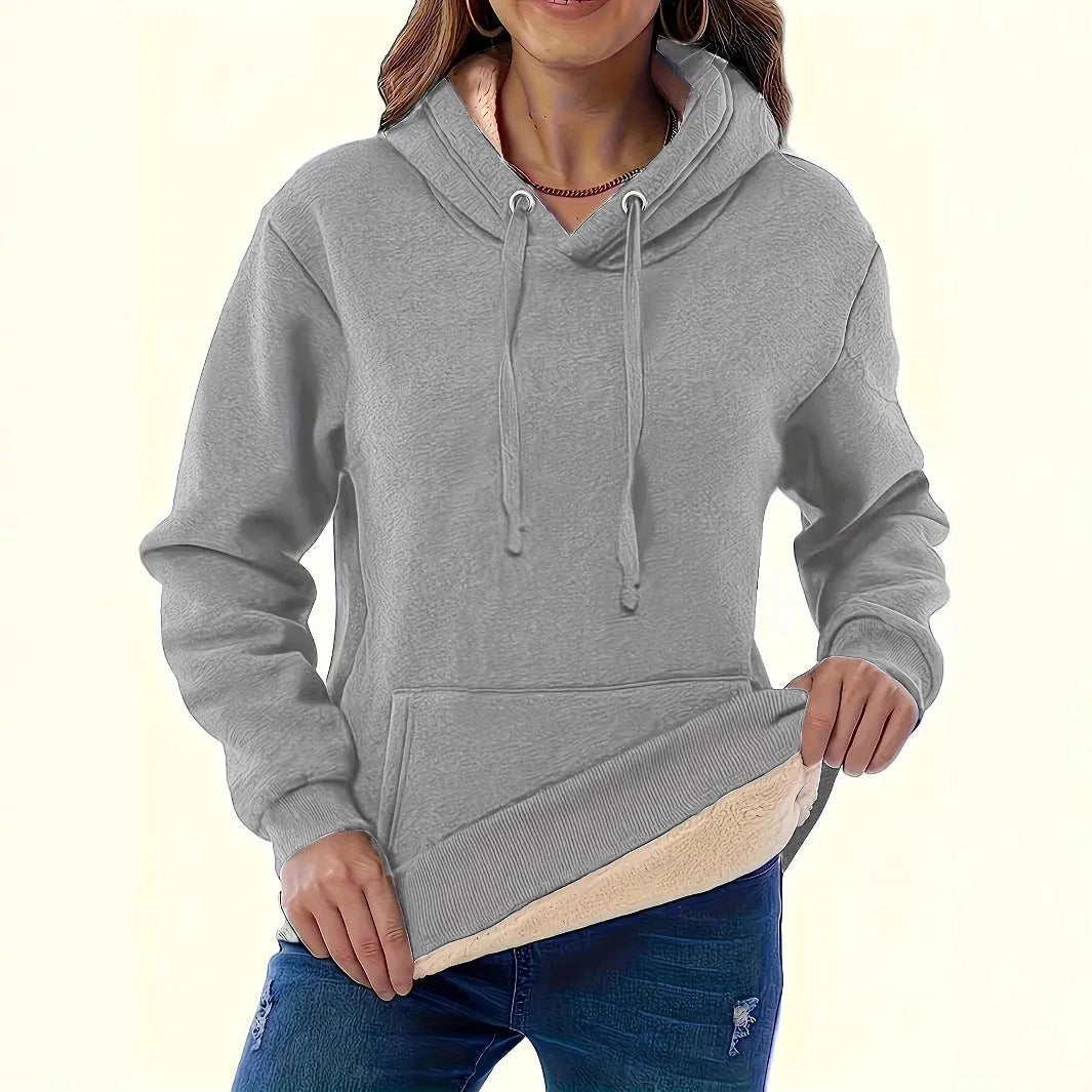 Women's loose fit hooded sweater in thick polyester fabric available in multiple colours.