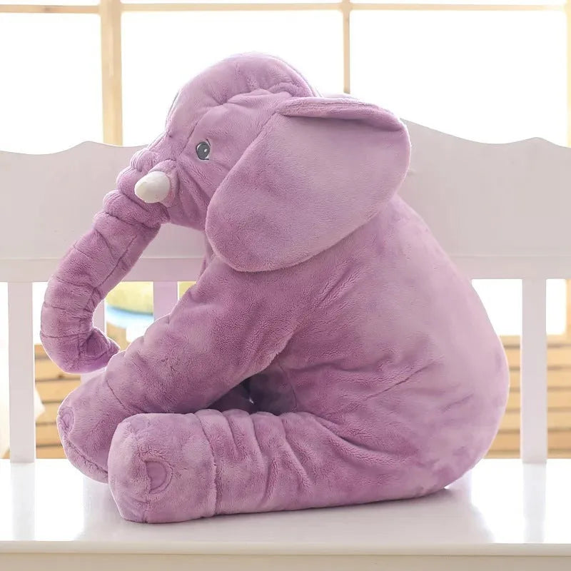 Soft grey elephant plush toy pillowcase for a child's bed.