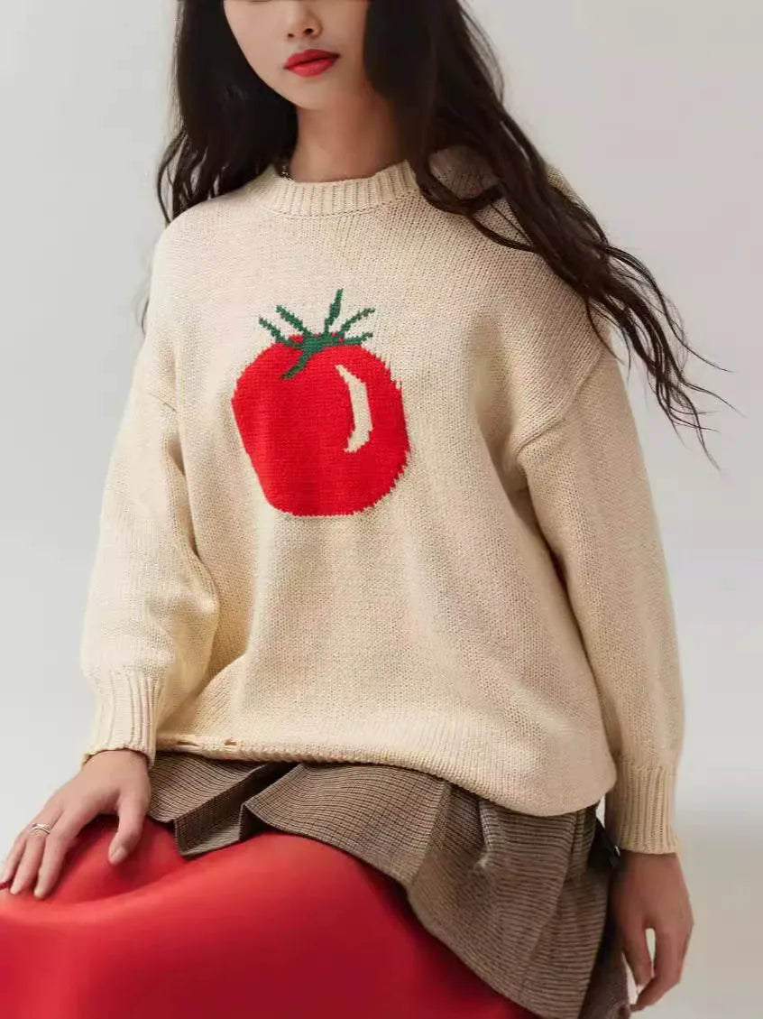 Beige women's loose-fitting acrylic jacquard knit sweater with round neck and long sleeves.