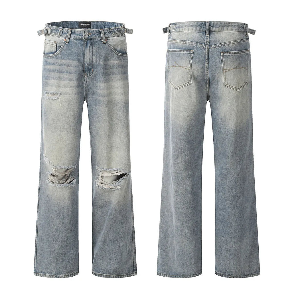 Blue men's straight-leg jeans with ripped detailing and a zip fly on a plain background.