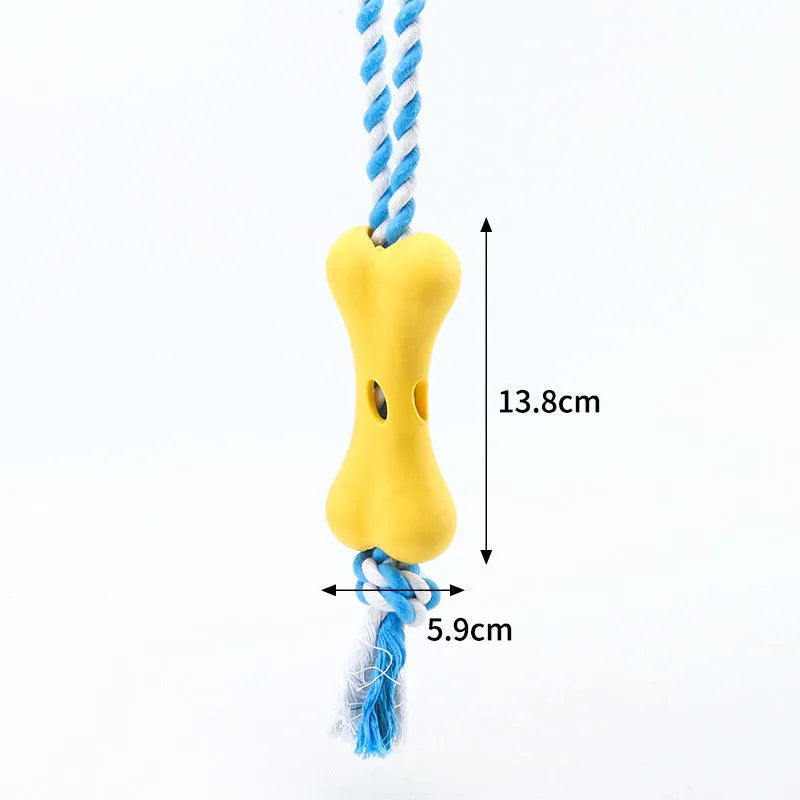 Green porous bone dog toy with rope knots for inserting treats, measuring 138x59x35mm
