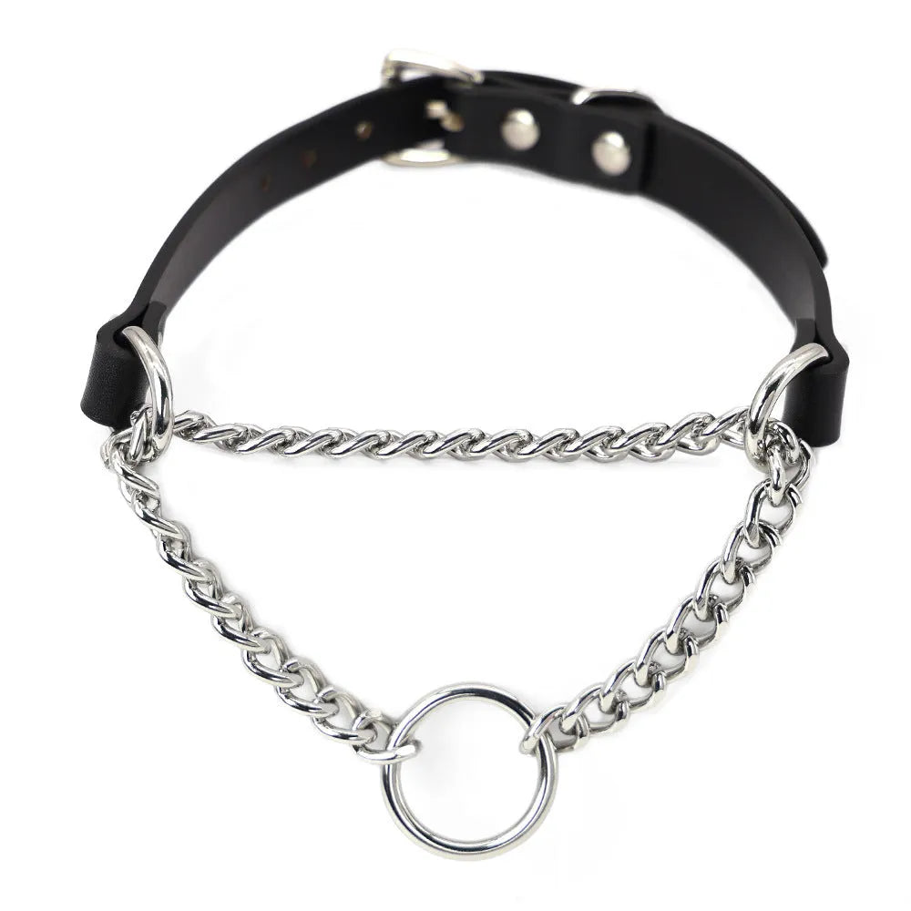 Black leather collar with chain detail and attached black leash on a dark background.