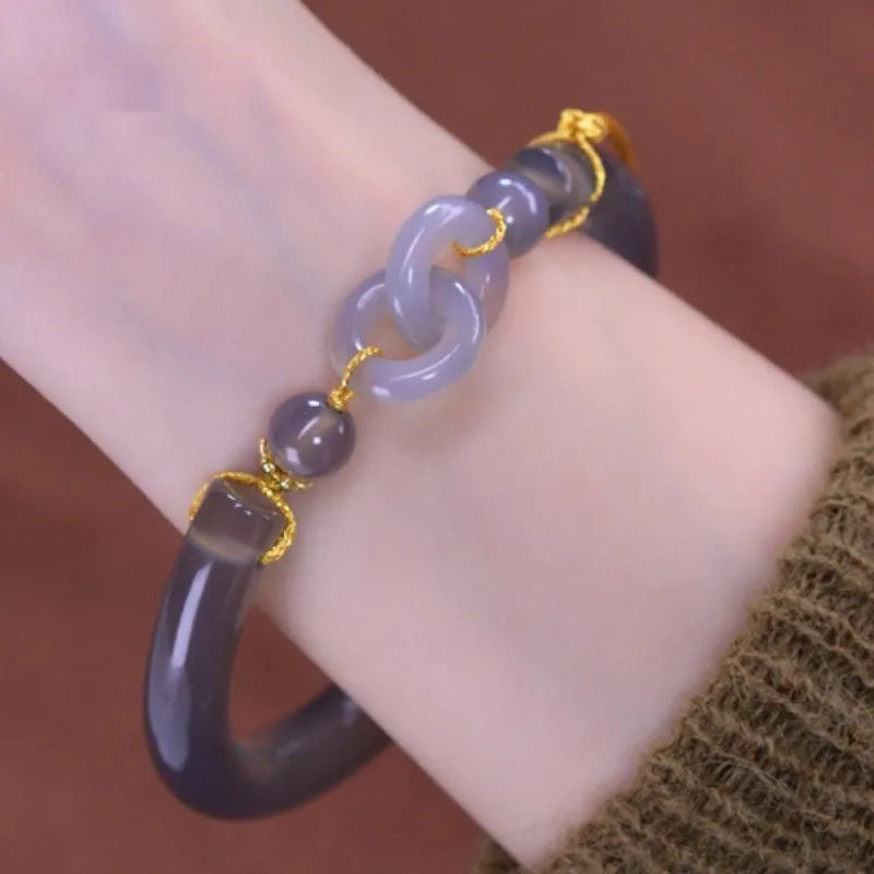 Smoke purple agate half bracelet with ring buckle closure on grey background