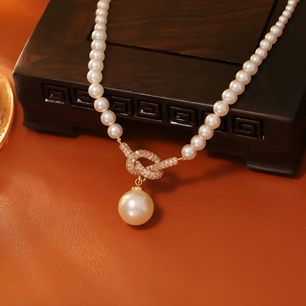 Knotted pearl pendant necklace with geometric brass micro inlay design for women