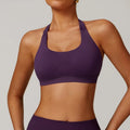 Women's black halter neck sports bra with adjustable back closure, shown from front and back.