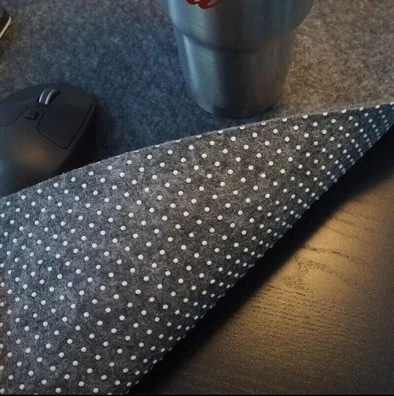Extra large felt mouse pad in brown, black, grey, or light grey with non-slip backing and machined edges.