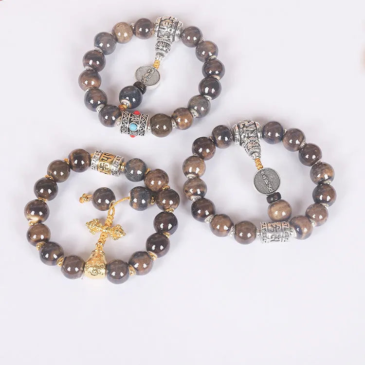 Men's gradient ceramic Yonghe blessing bracelet with coloured glaze beads on a wrist.