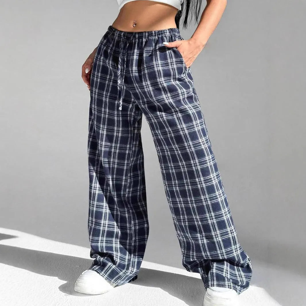 Women's red and blue plaid casual trousers with a drawstring waist and side pockets.