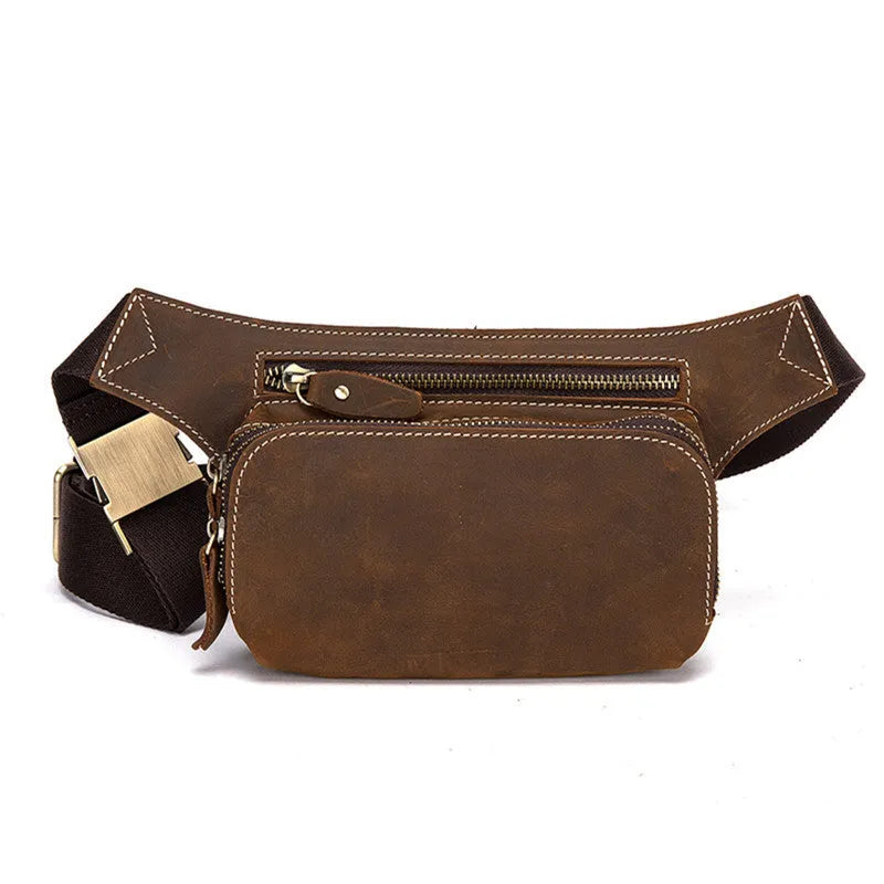 Brown top layer cowhide men's waist bag with pull cord closure, shown with a 10-inch laptop and mobile phone.
