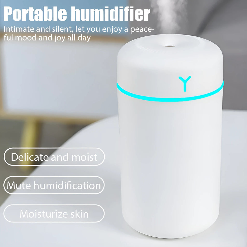 White columnar plastic desktop USB humidifier with single fog outlet for indoor use