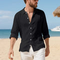 Man wearing a loose-fit light blue linen casual shirt with a non-iron finish, buttoned front, and classic collar.
