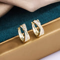Geometric earrings with zircon embellishments in 14K yellow gold plating on copper