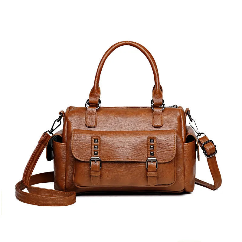Large vintage-style messenger bag in a horizontal square shape, showing stitching detail, displayed in multiple colour options.