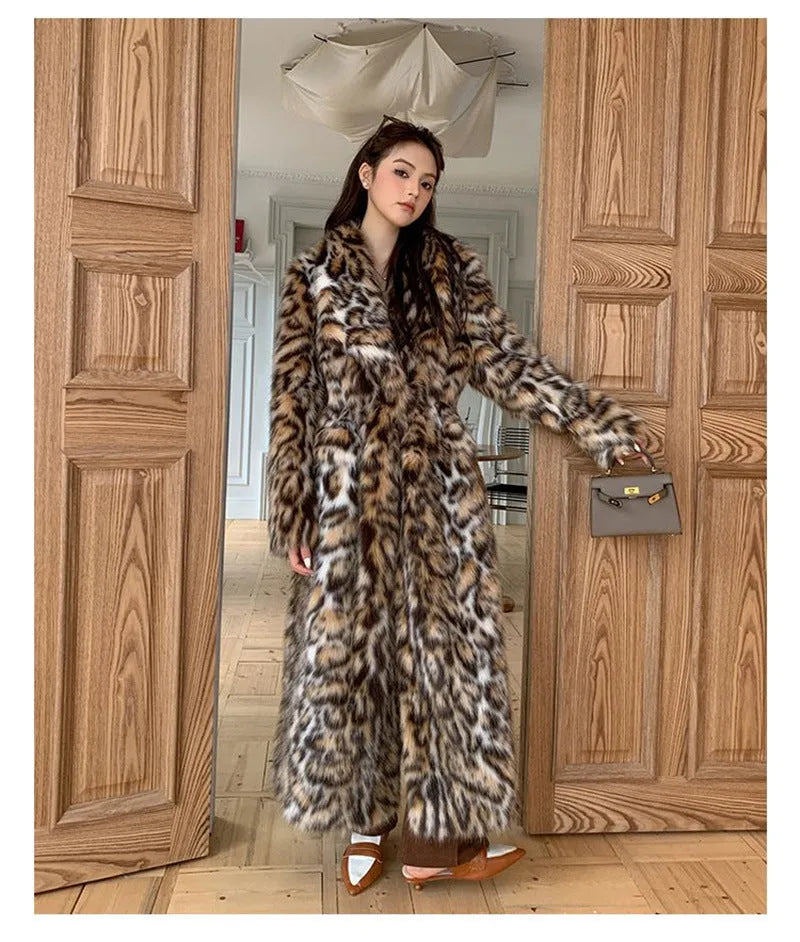 Long grey faux fur coat with a detachable fur collar and pockets on a model.