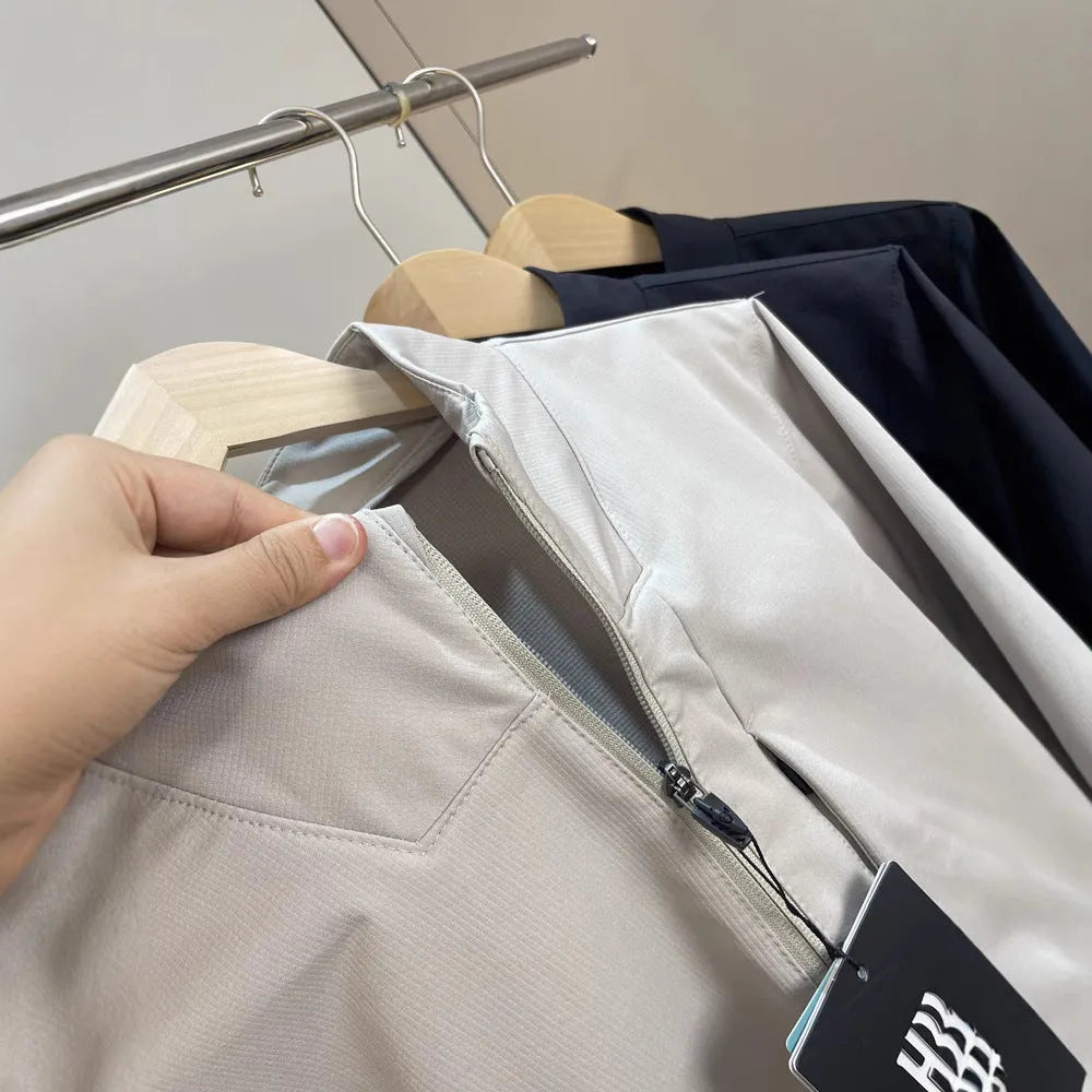 Men's stand collar casual jacket in polyester, shown in black, dark blue, or milky white.