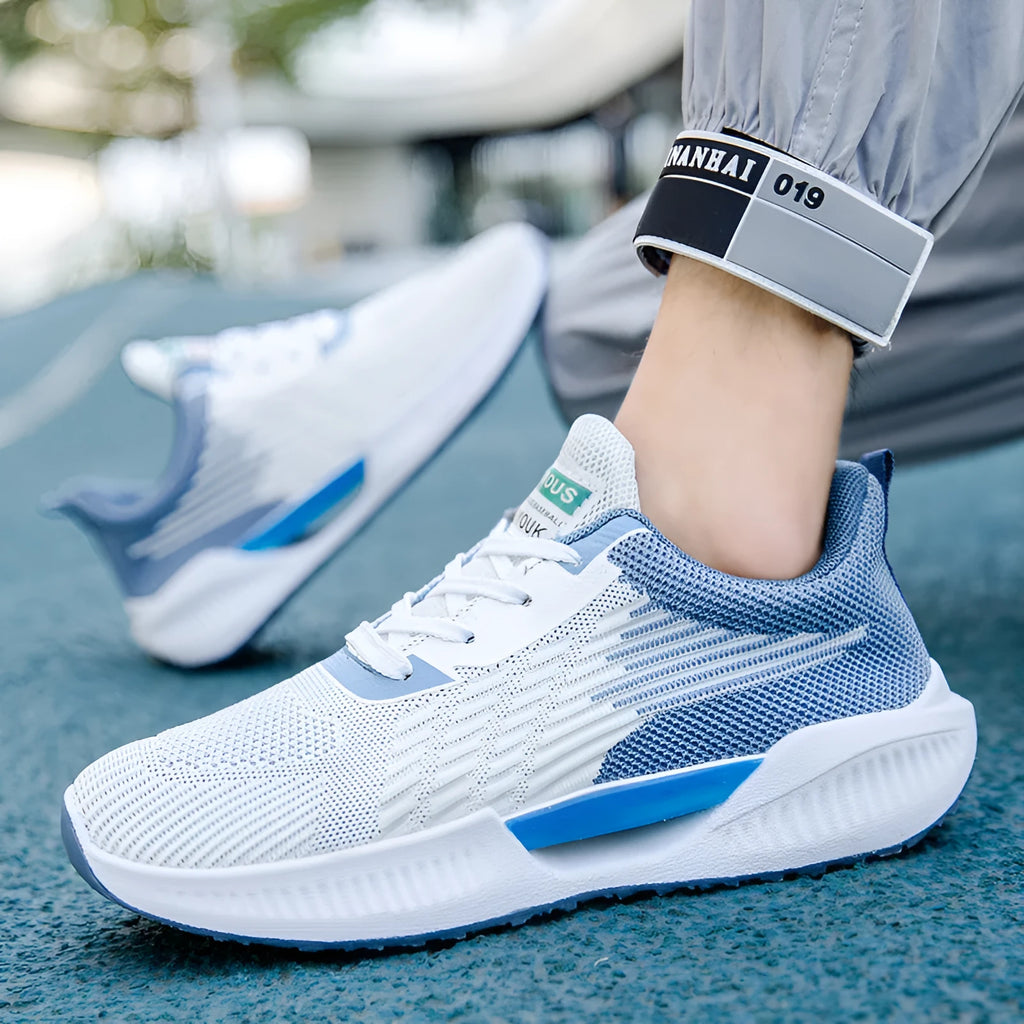Men's blue casual mesh sports shoes with round toe and cloth upper.