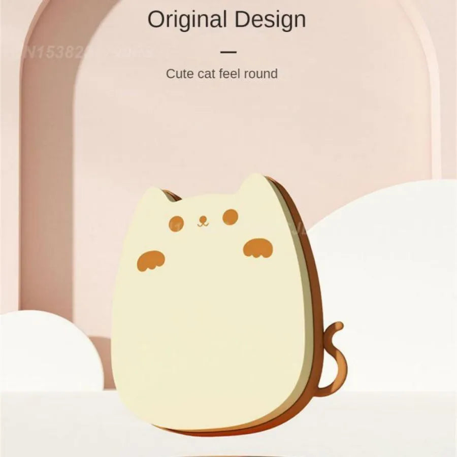 Brown silicone pet grooming brush with dual-texture comb teeth on a white background.