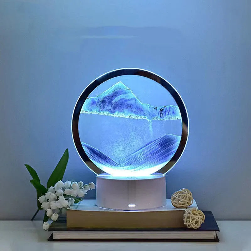 Blue 3D quicksand table lamp with USB cable and touch switch on a wooden surface