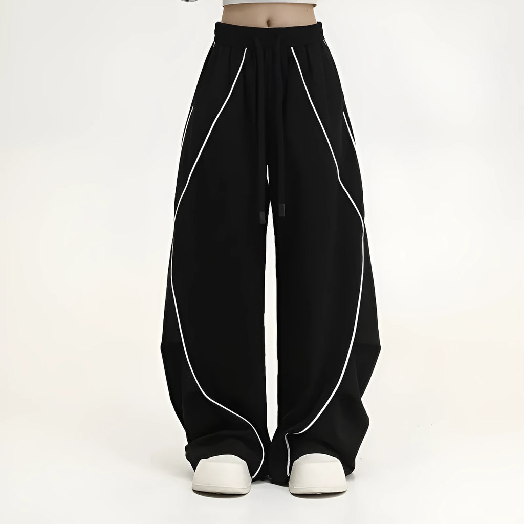 Black pleated wide-leg hip hop sports trousers with striped pattern and elasticated waist.