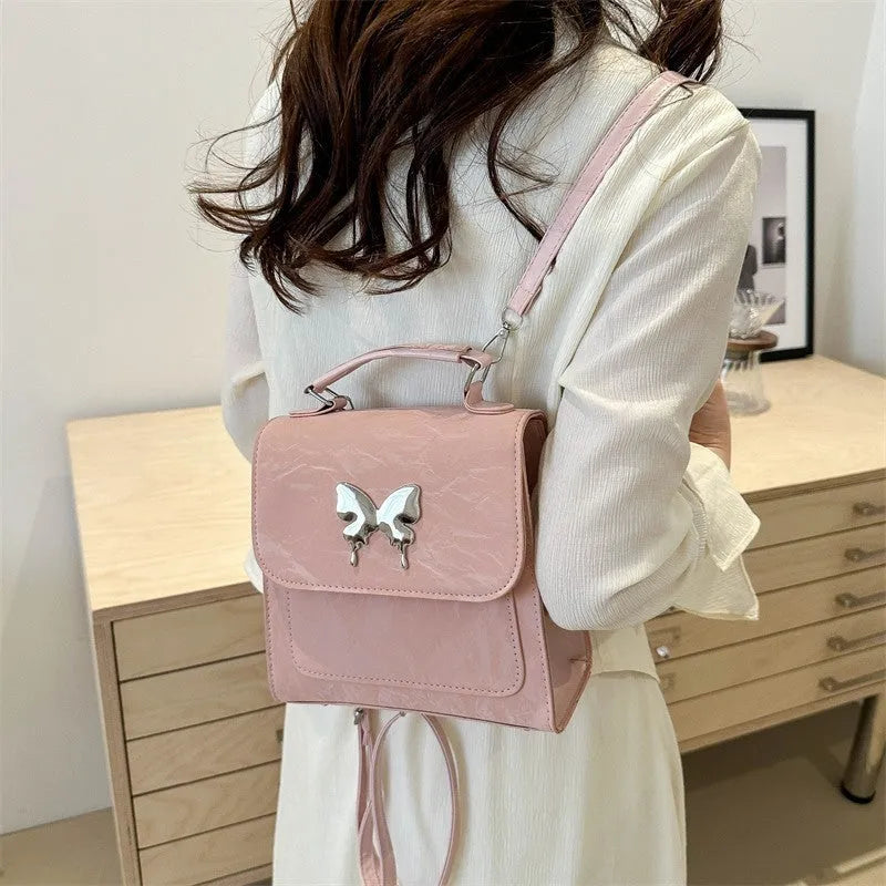 Women's preppy style PU synthetic leather backpack with bow detailing in six colour options